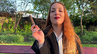Liz Rainbow Smoking a Flor De Oliva Cigar Outdoors