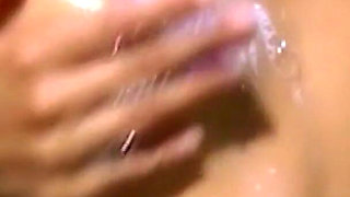 Mature MILF Explores Her Curves in Steamy Shower