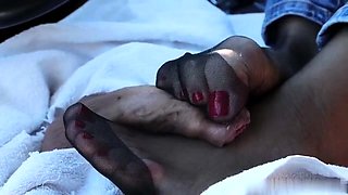 MILF seductress in pantyhose delivers footjob masterpiece