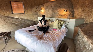Masked Latex Fuck Toy Masturbates in Africa