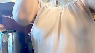 Mature woman in transparent granny night gown, natural tits