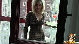 Naughty chick masturbating on the balcony