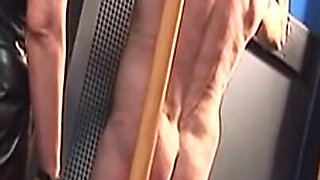 Dominatrix Trains Hooded Slave with Huge Dildo