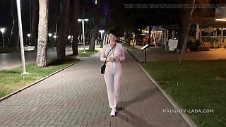 Naughty Lada: Brunette MILF Flashing Pussy in See-Through Dress at Night Bar