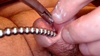 Sounding my cock and clamping my glans