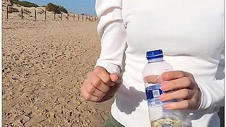 Beach Deal: She Pees Into A Bottle, Sells It, He Drinks It All In Public