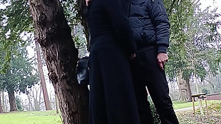 Muslim woman plays and blows a large cock outside in the park