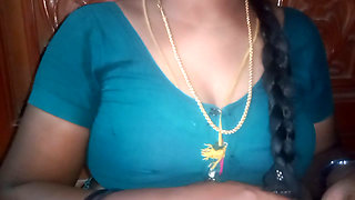 Tamil aunty squeezing her breasts when she is alone and unable to control her emotions.