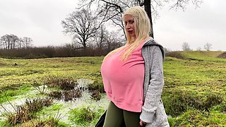 Blonde is flashing her big boobs in the outdoors