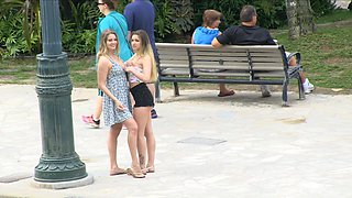 Long-haired beauties indulge in public lesbian sex on the beach