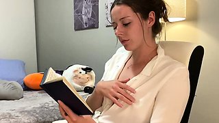 Voyeur of sexy brunette reading a hot romance novel and