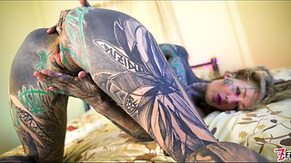 Tattooed girl fingering her pussy and ass