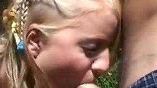 The blonde smokes a cigarette in the countryside, a guy passes by and puts his hard cock in her mouth