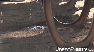 Adriana Chechick and her friend compete in farthest peeing contest in public