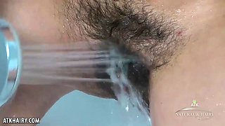 Lexie using a showerhead to cum
