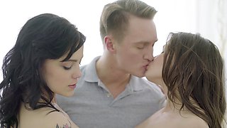 Two cute girls share a big cock in an intense threesome