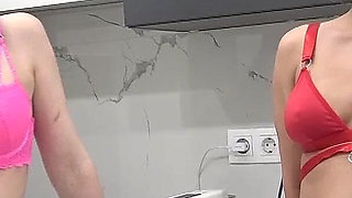 Two Stunning Looking Chicks Pissing on Their Slaves