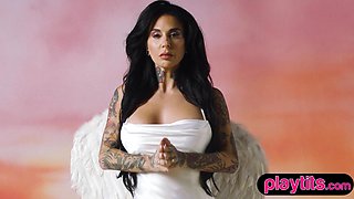 Curvy tattooed MILF shows off big boobs