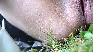 Milf masturbates and pees in the forest