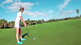 Blonde is having a very sexy game of golf