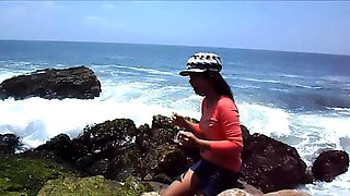 Amateur Asian teen masturbates outdoors