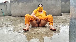 Pakistani mommy savors the rainfall