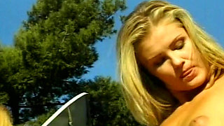 Platinum blonde babes enjoying lesbian action outdoors