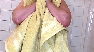 Busty babe playing with her big boobs