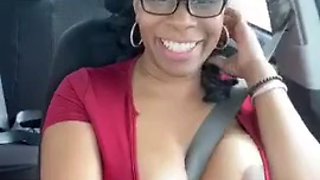 Solo ebony Desiree Desire shows her tits while driving