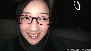 Nerdy Japanese babe Suzuhara Emiri exposes her creamy pussy in a car