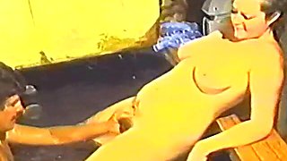 The busty brunette enjoys a lazy day by the pool.