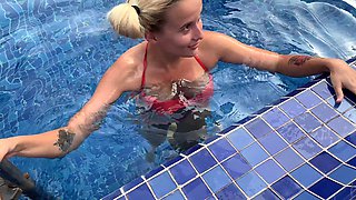 Blonde bombshell with natural tits blows a huge dick outside by the pool