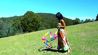 Amateur Asian babe sucks a lolly as she rubs her pussy