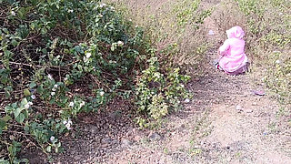 Sister-in-law is walking on the bridge by the roadside, getting down on the shore, sister-in-law started taking her clothes from the toilet and fingering her pussy.