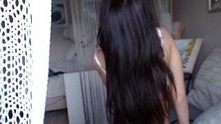 Busty curly brunette with big boobs fucks on couch